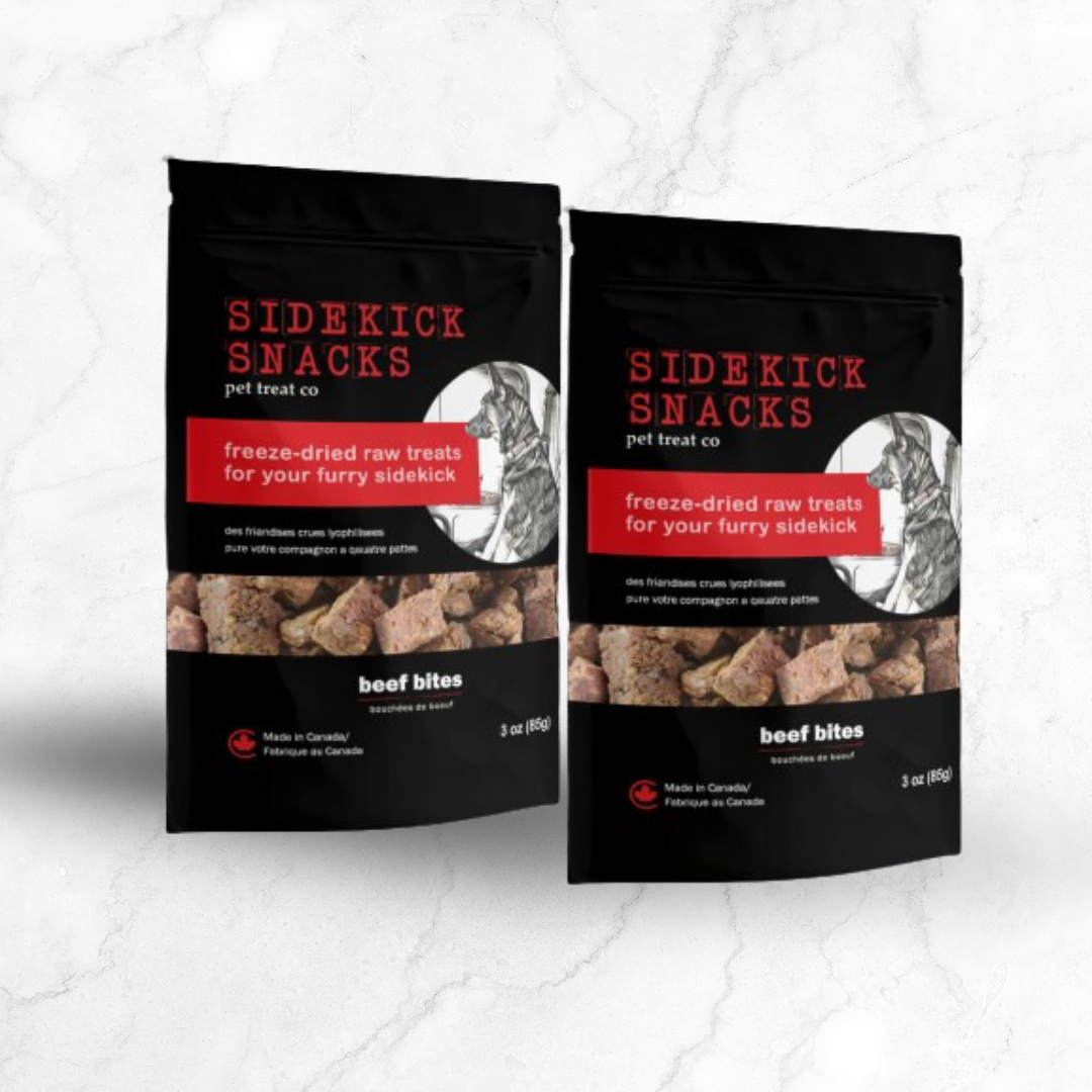 Two packages of Sidekick Snacks pet treat co beef bites on a light gray background