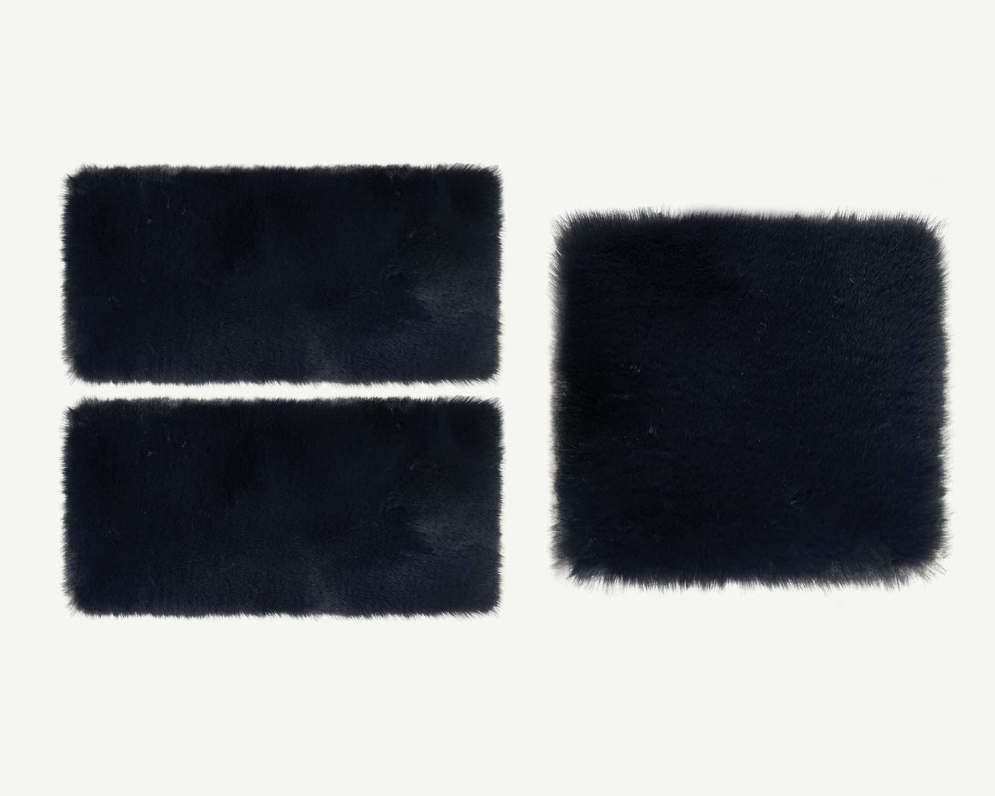 Three black rectangular faux fur patches on a white background