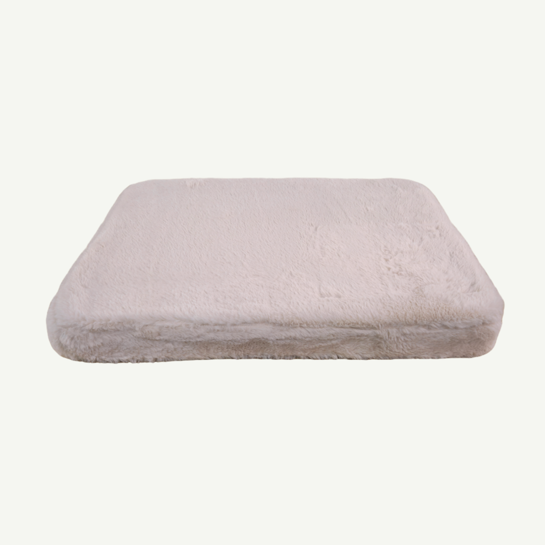 Rectangular pink pet cushion on a white background