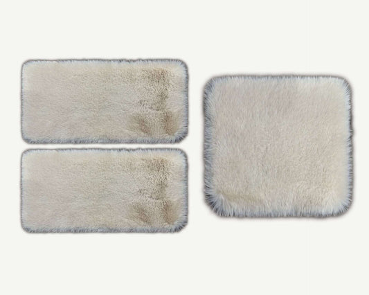 Three rectangular cleaning pads with varying degrees of dirt on a white background