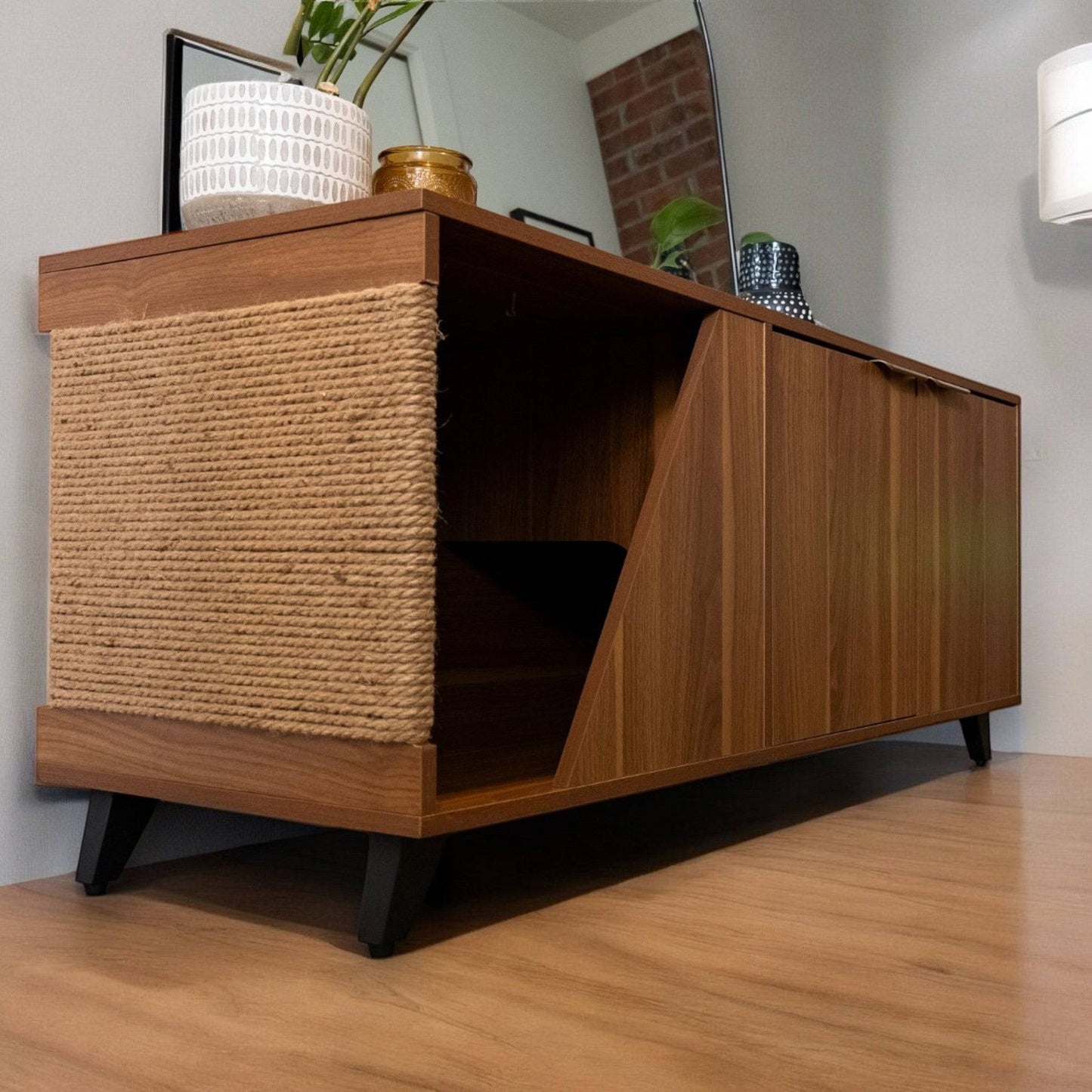 Wooden sideboard with woven design on a wooden floor