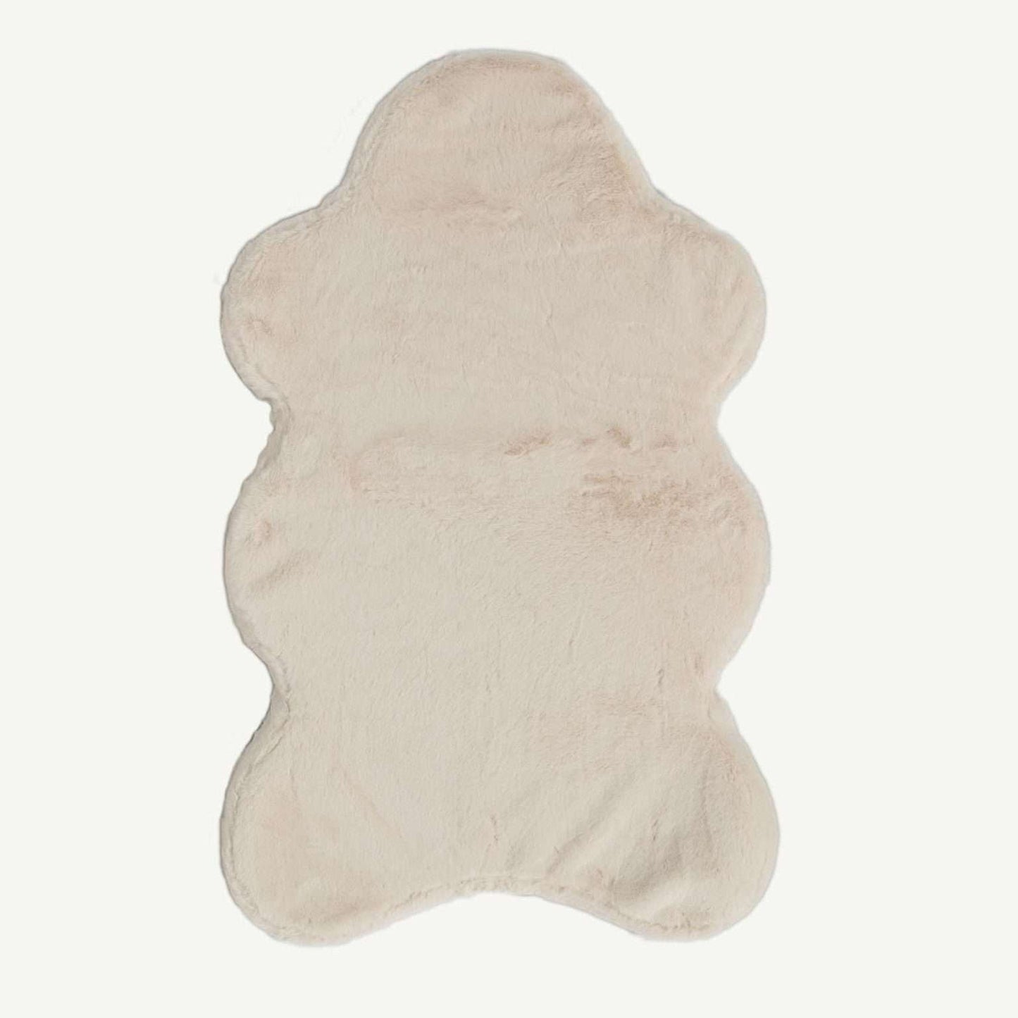 Beige cowhide rug on a white background