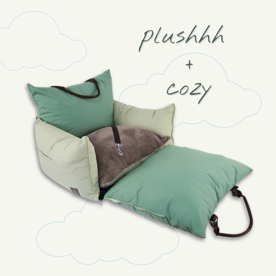 Green pet bed with text 'plushhh + cozy' on a white background