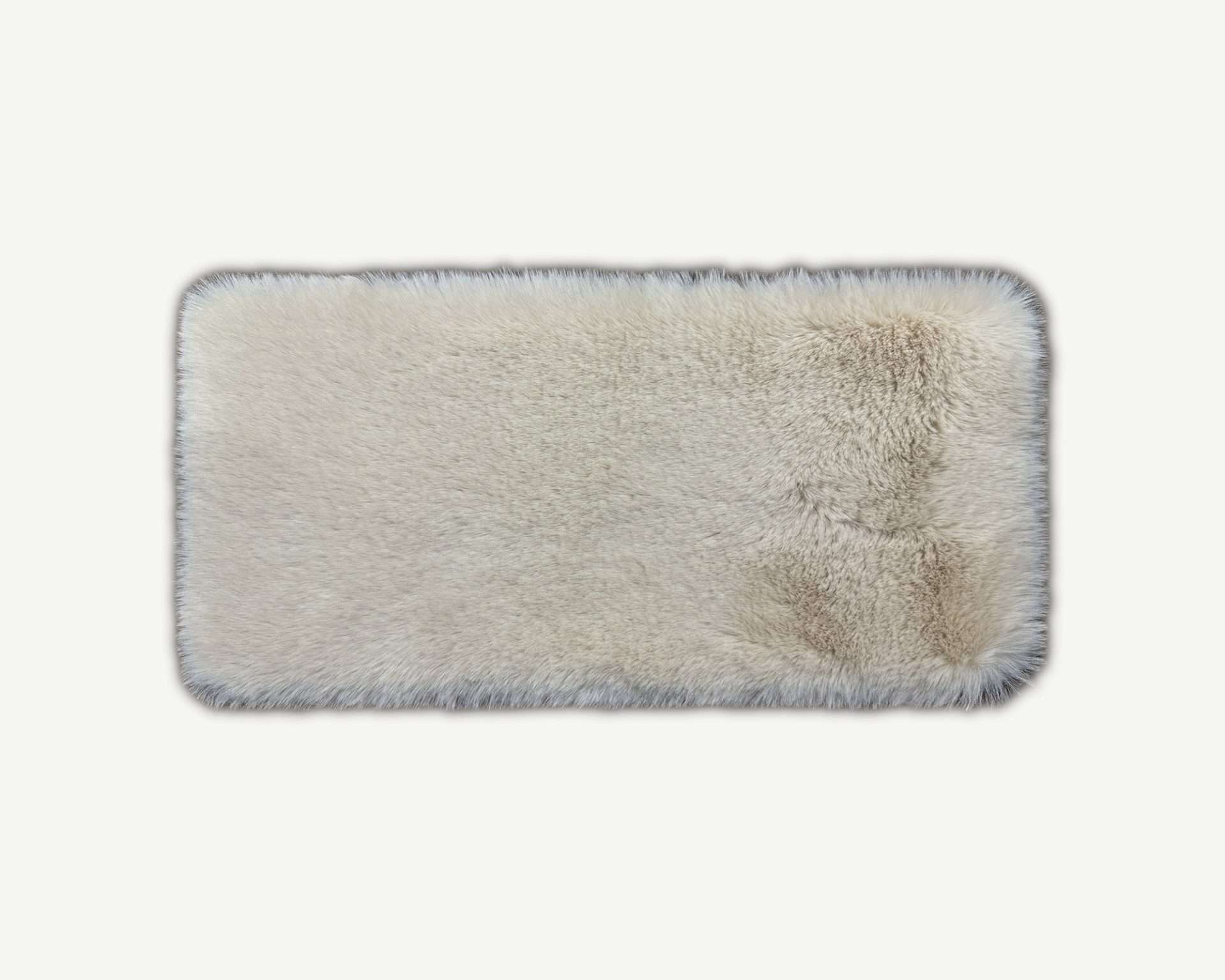Rectangular bath mat with textured surface on a white background