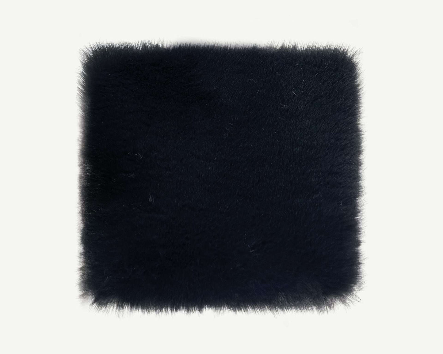 Black faux fur square on a white background