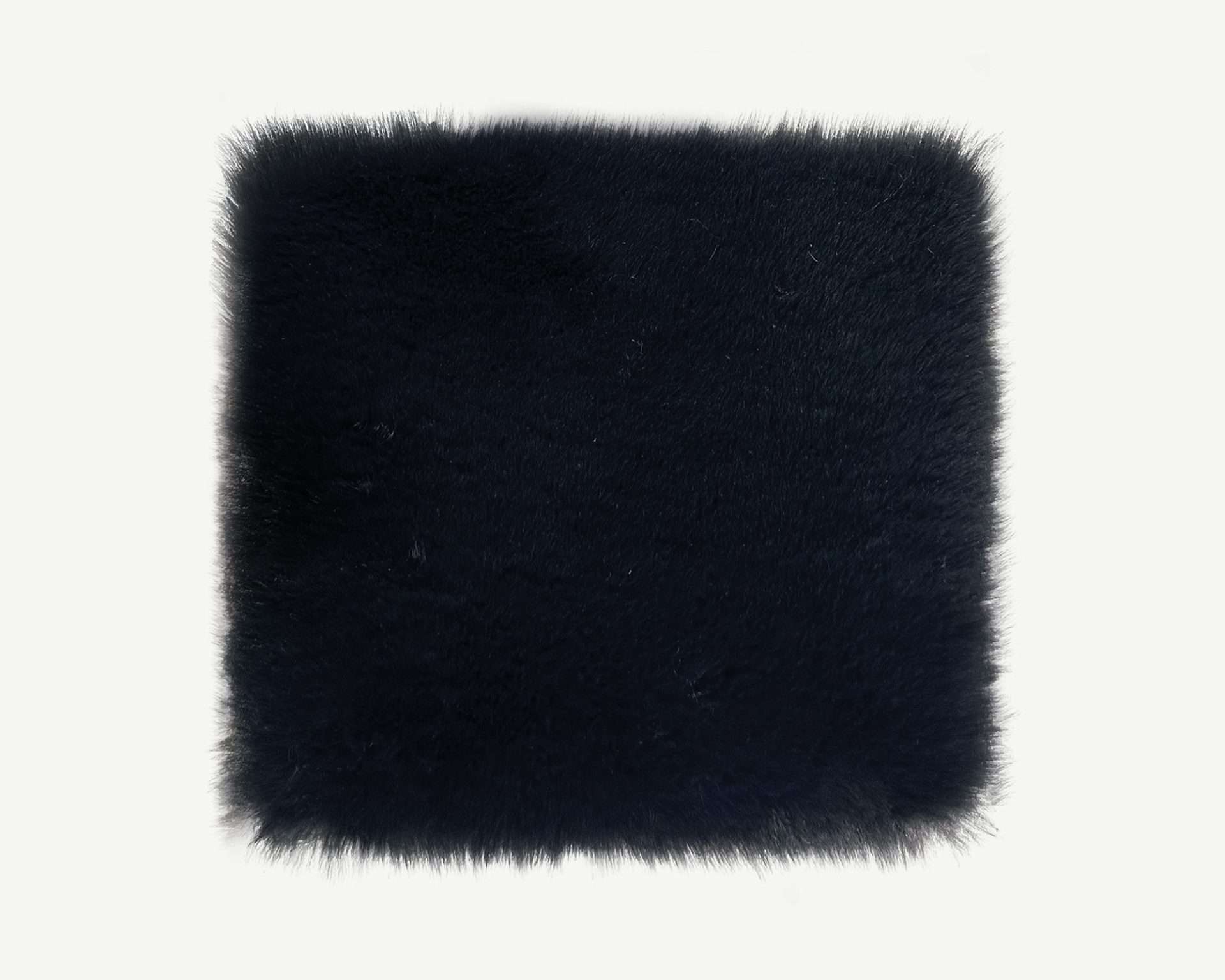 Black faux fur square on a white background