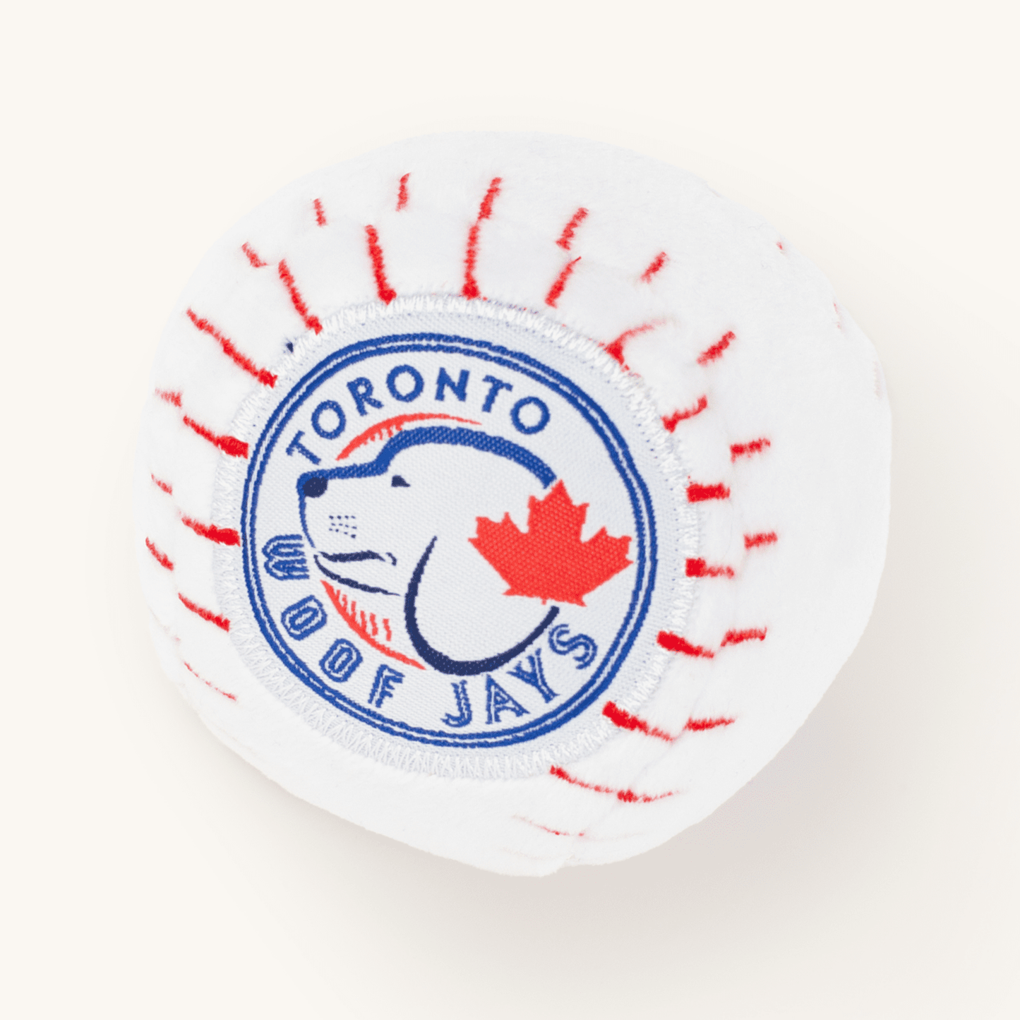 Circular patch with 'Toronto Woof Jays' text and a dog and leaf design on a white background