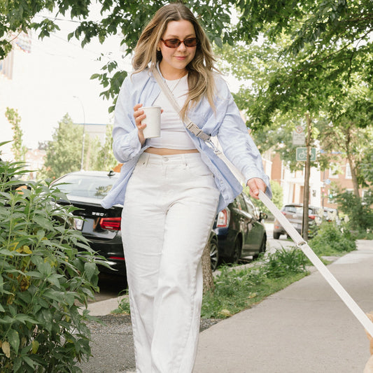 woman walking on the sidewalk with the adjustable, hands-free leash