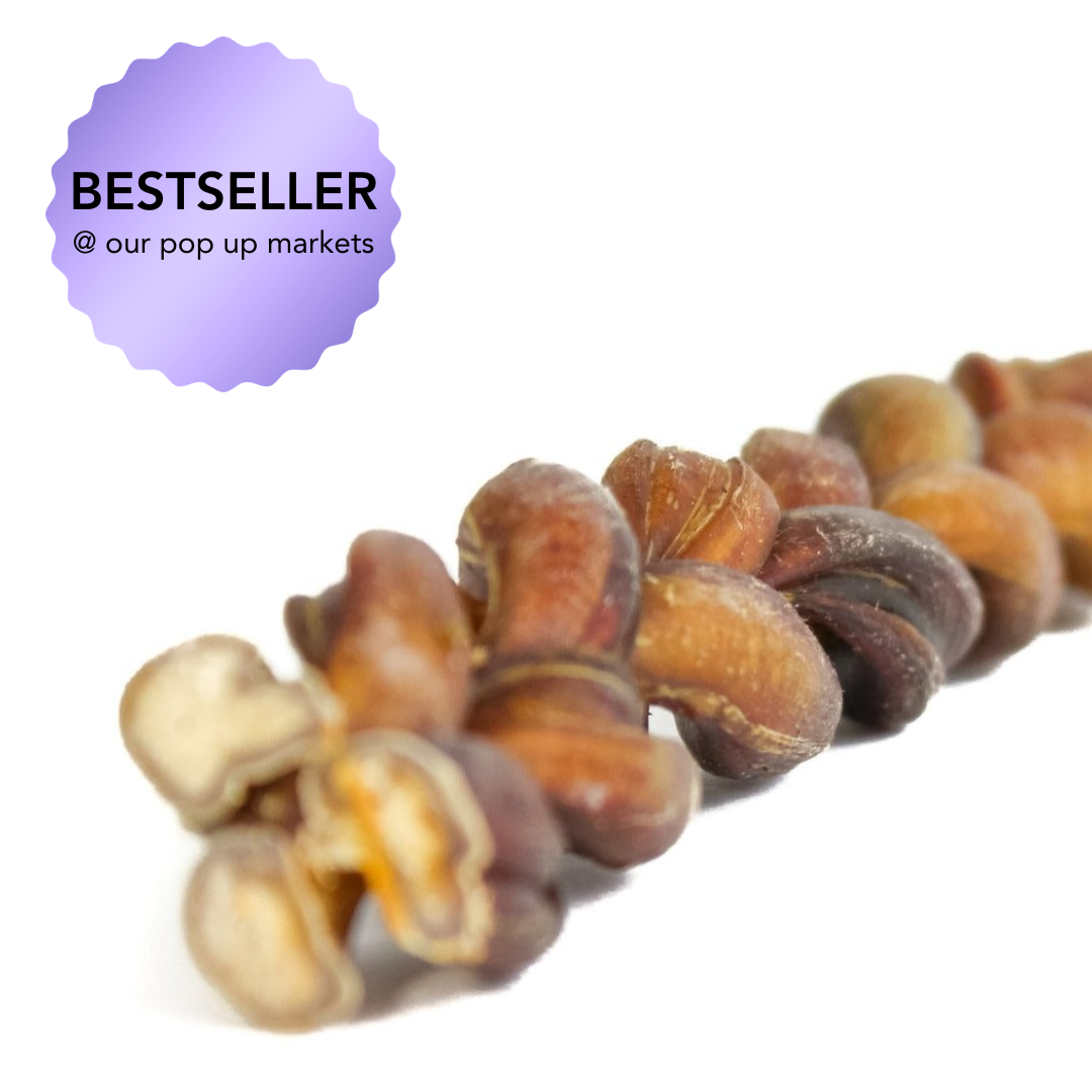 Close-up of braided bully stick with a 'BESTSELLER' label on a white background