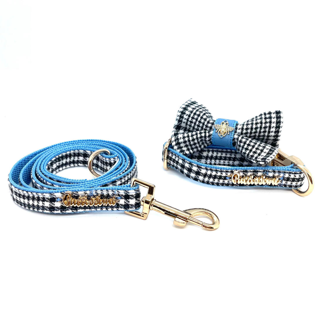 Dog leash and bow tie set with blue and black checkered pattern on a white background