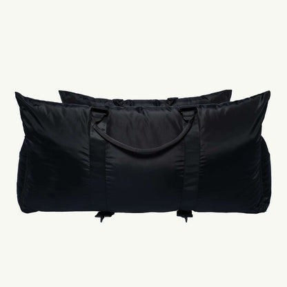 Black travel pet bed bag with handles on a white background