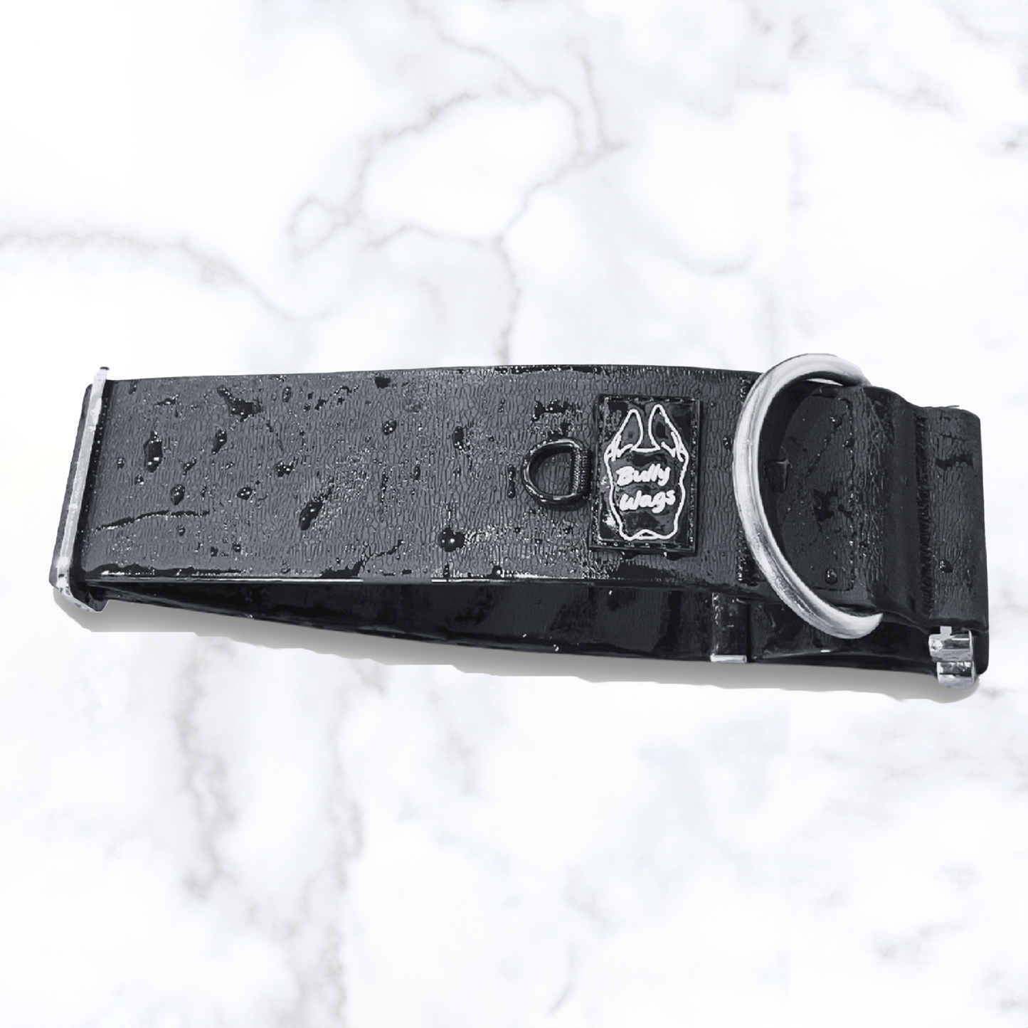 close up of a black waterproof collar with water droplets on it.