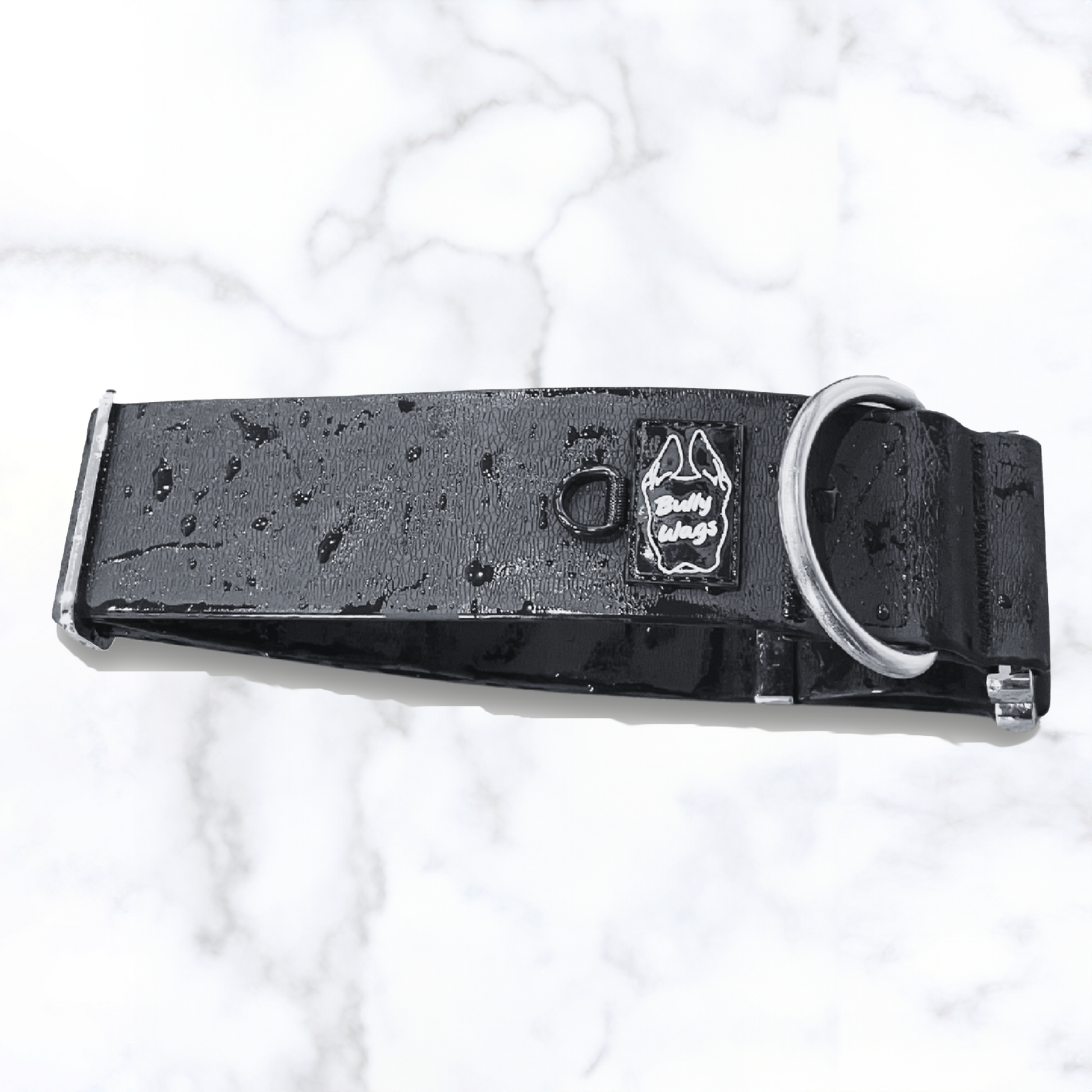 close up of a black waterproof collar with water droplets on it.