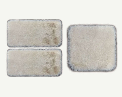 Three rectangular cleaning pads with varying degrees of dirt on a white background