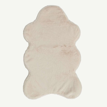 Beige cowhide rug on a white background