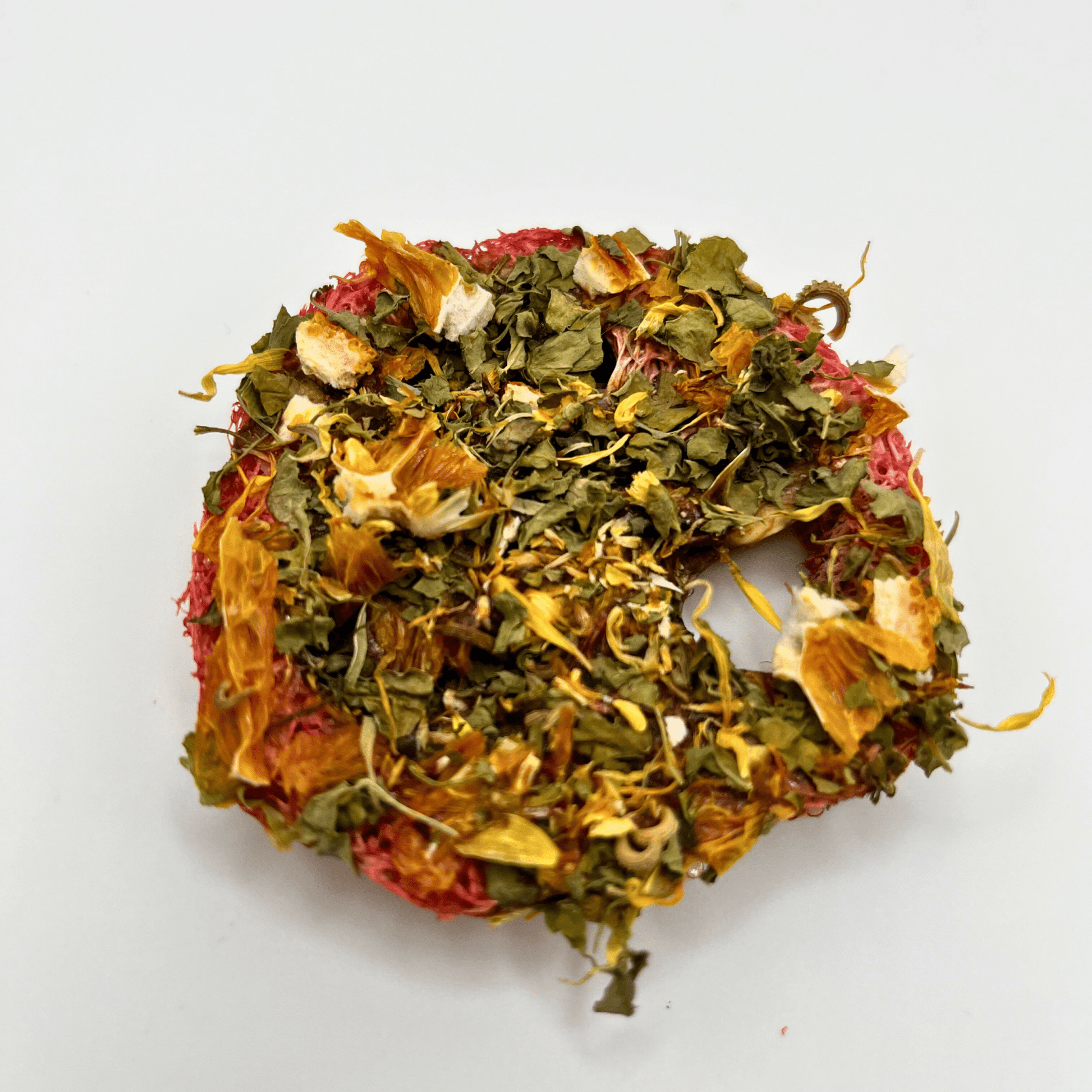 Wreath made of dried flowers and leaves on a white background