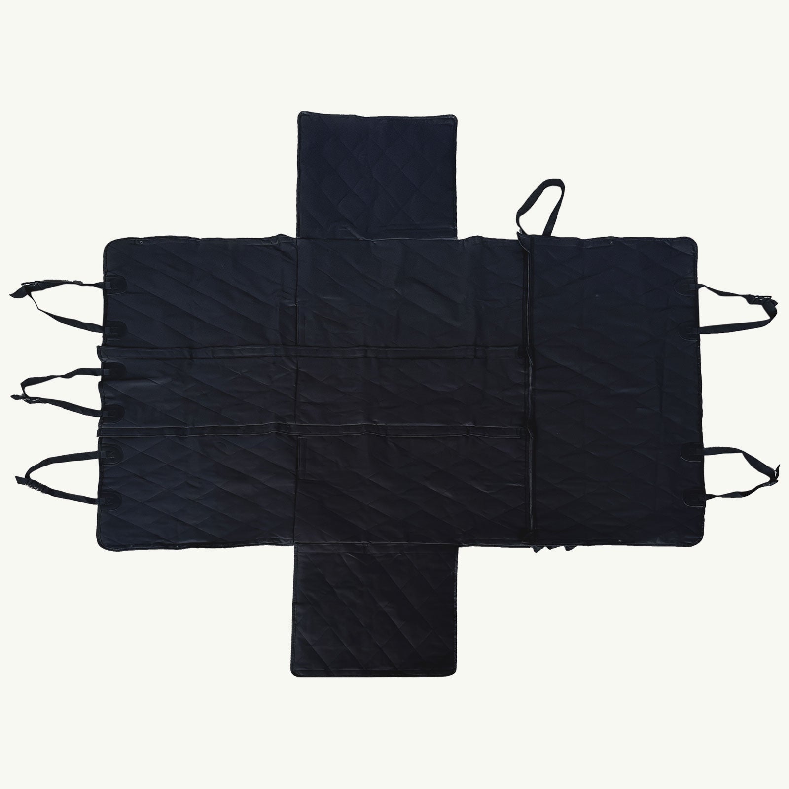 Black quilted car seat cover with straps on a white background