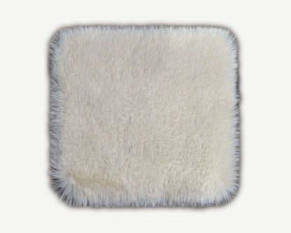 Square textured mat with frayed edges on a white background