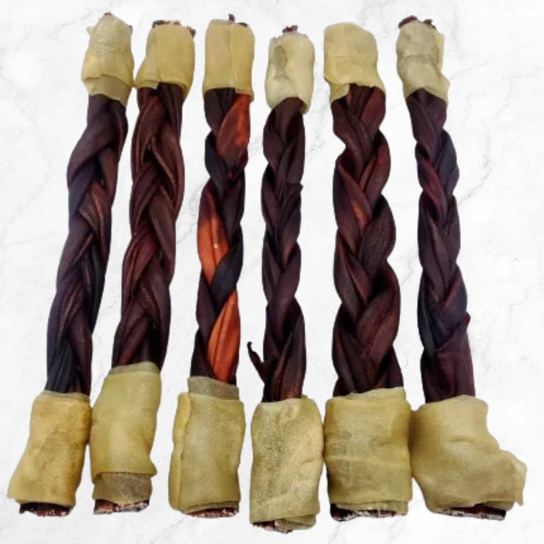 Set of braided dog treats with beige ends on a white background