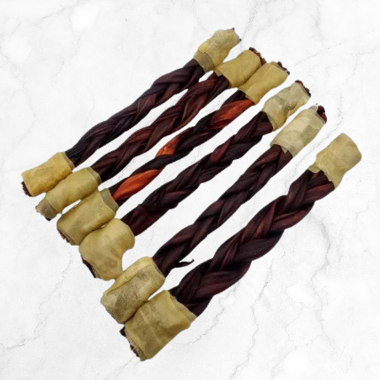 Dog chew treat with braided design on a white background