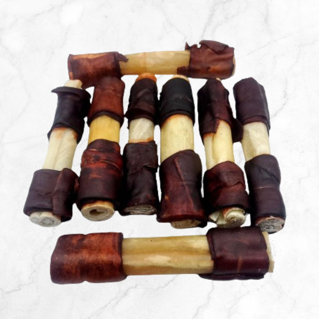 Set of collagen dog chew toys on a white background