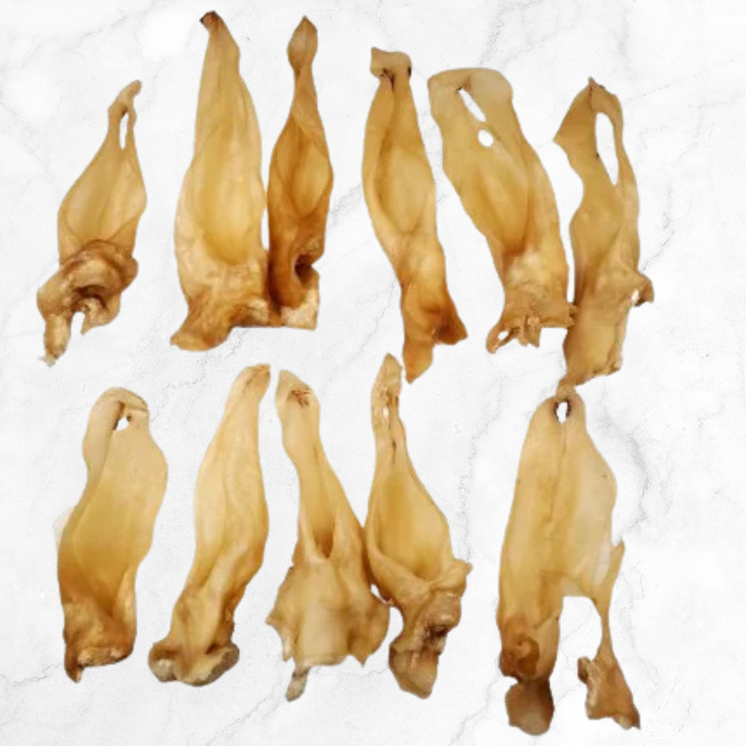 Multiple dried goat ears arranged in a grid on a white background