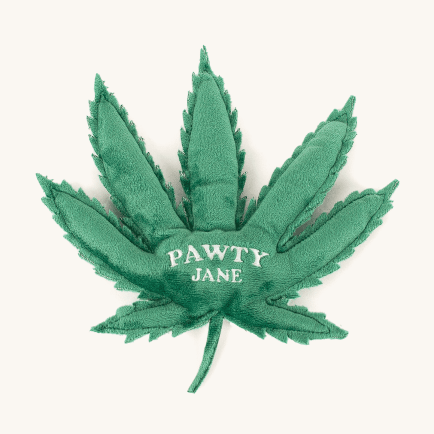 Green leaf-shaped toy with 'PAWTY JANE' text on a white background