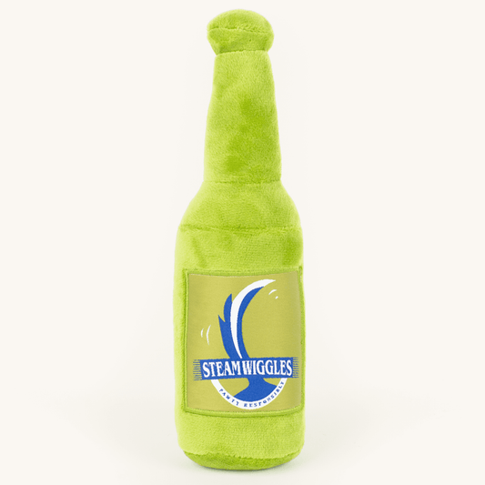 Green plush bottle toy with 'Steam Wiggles' label on a white background