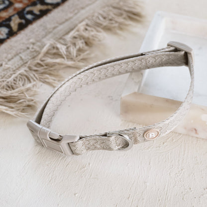 Decorative collar with intricate designs on a textured surface
