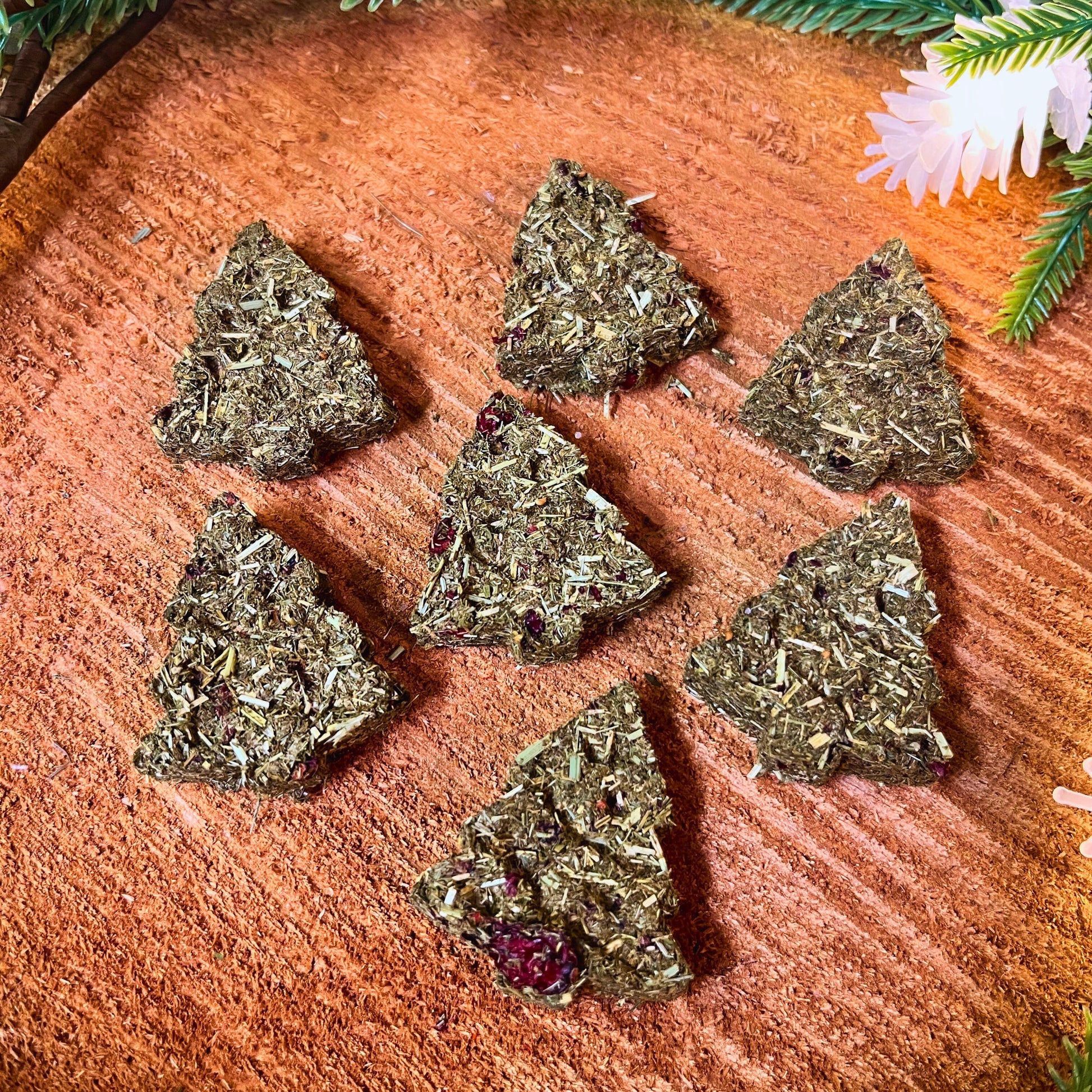 Oh Christmas Tree Hay Bites small pet treats from Floof Pet Products on a neutral background