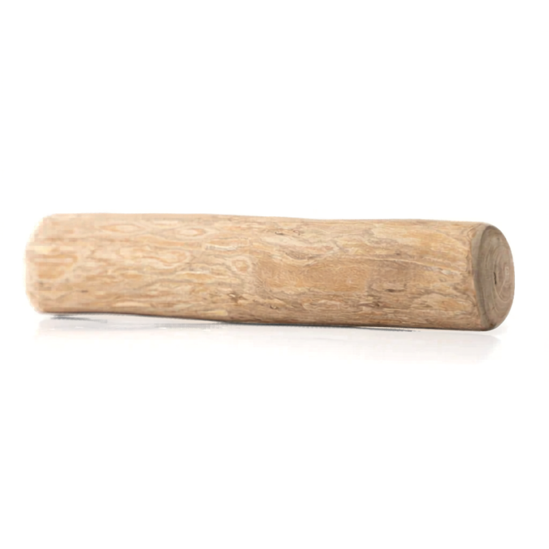 close up of a coffee wood chew for dogs on a white background